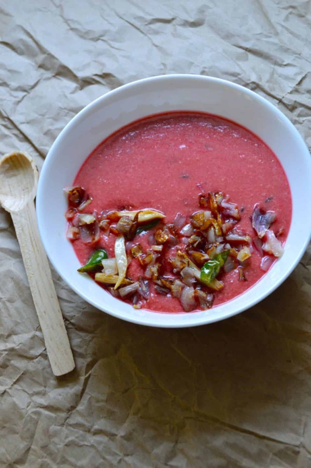 Beetroot Kadhi dish in a white bowl.