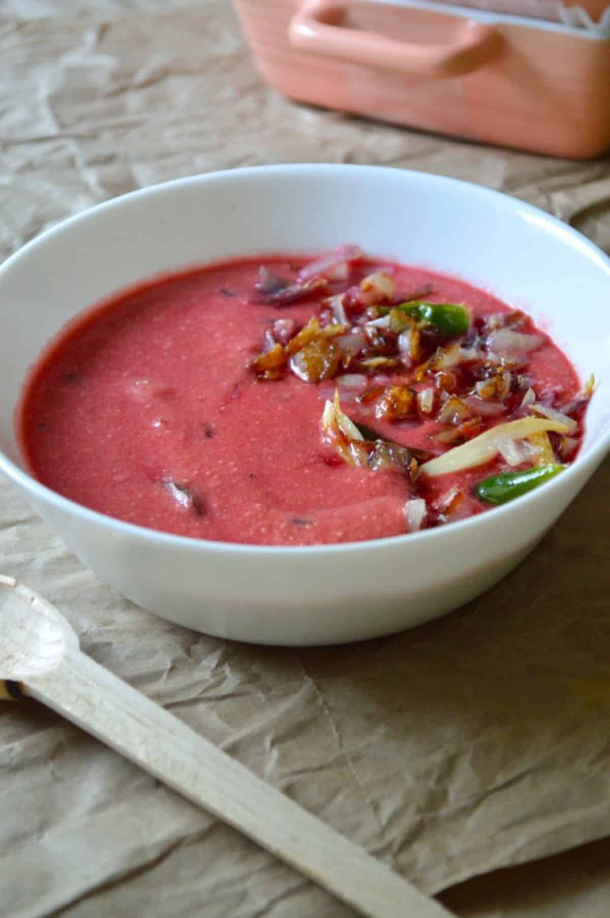 Beetroot Kadhi dish in a white bowl.