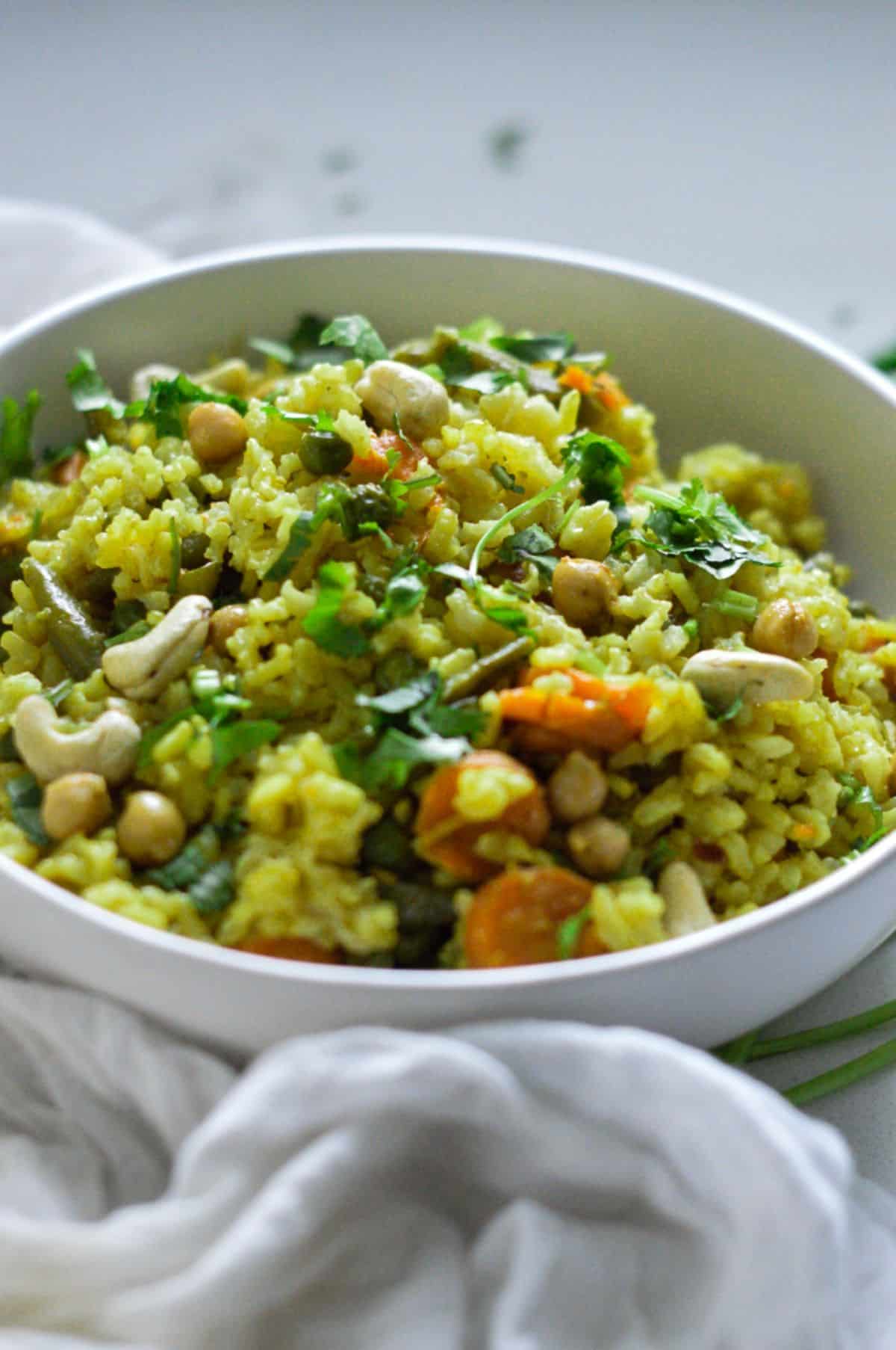 Brown Rice Masala Pilaf in a white bowl.