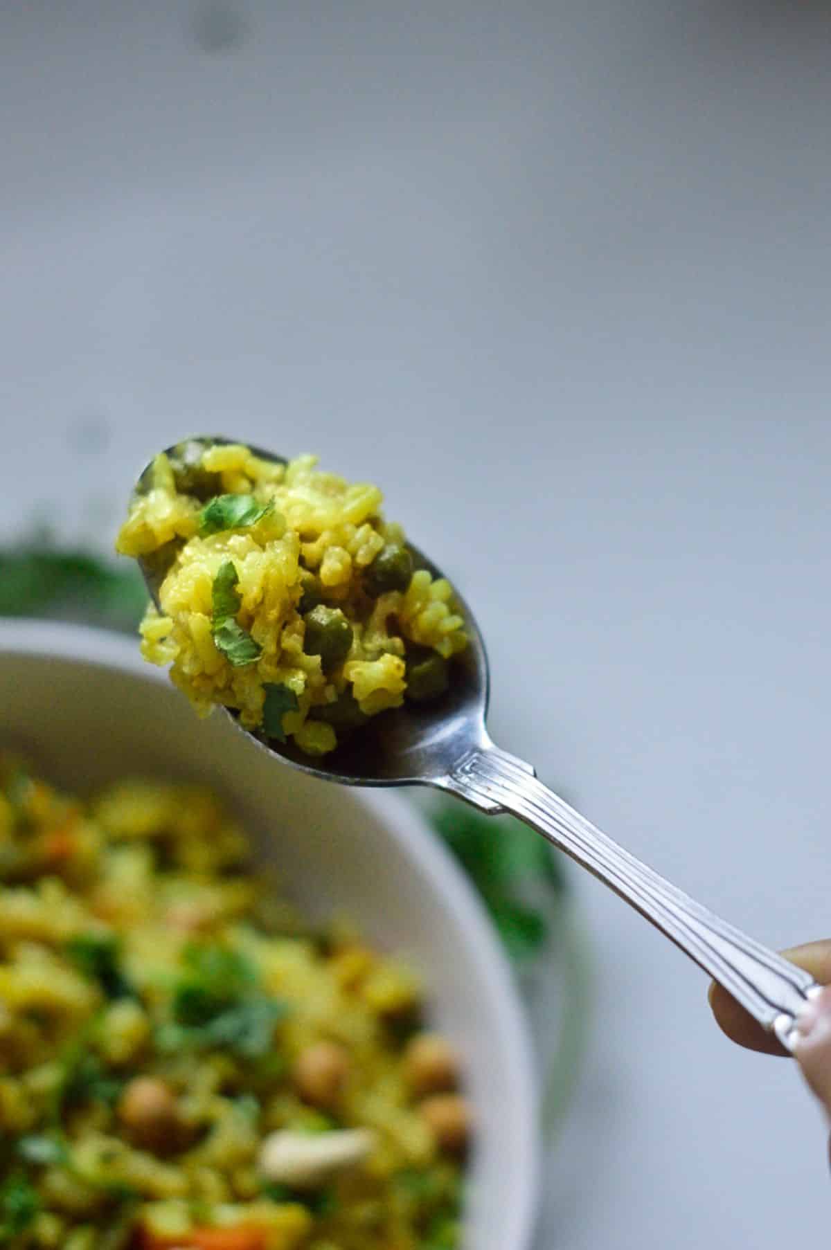 Brown Rice Masala Pilaf on a spoon.