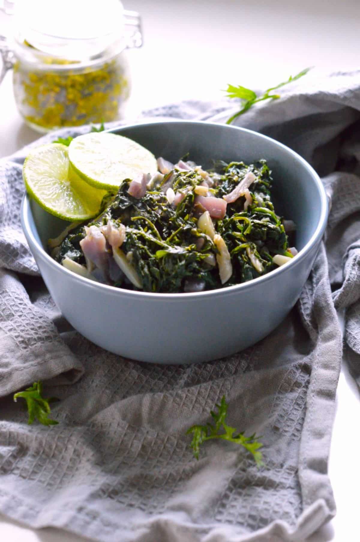 Carrot Greens Sabzi  in a blue bowl.