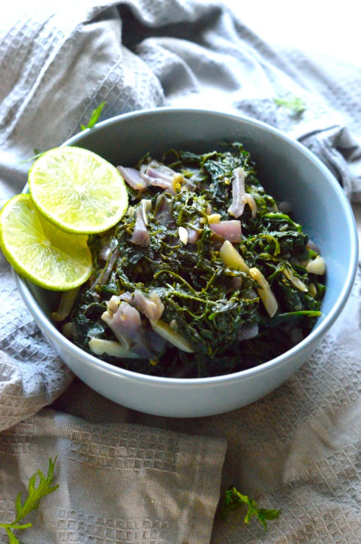 Carrot Greens Sabzi in a blue bowl.