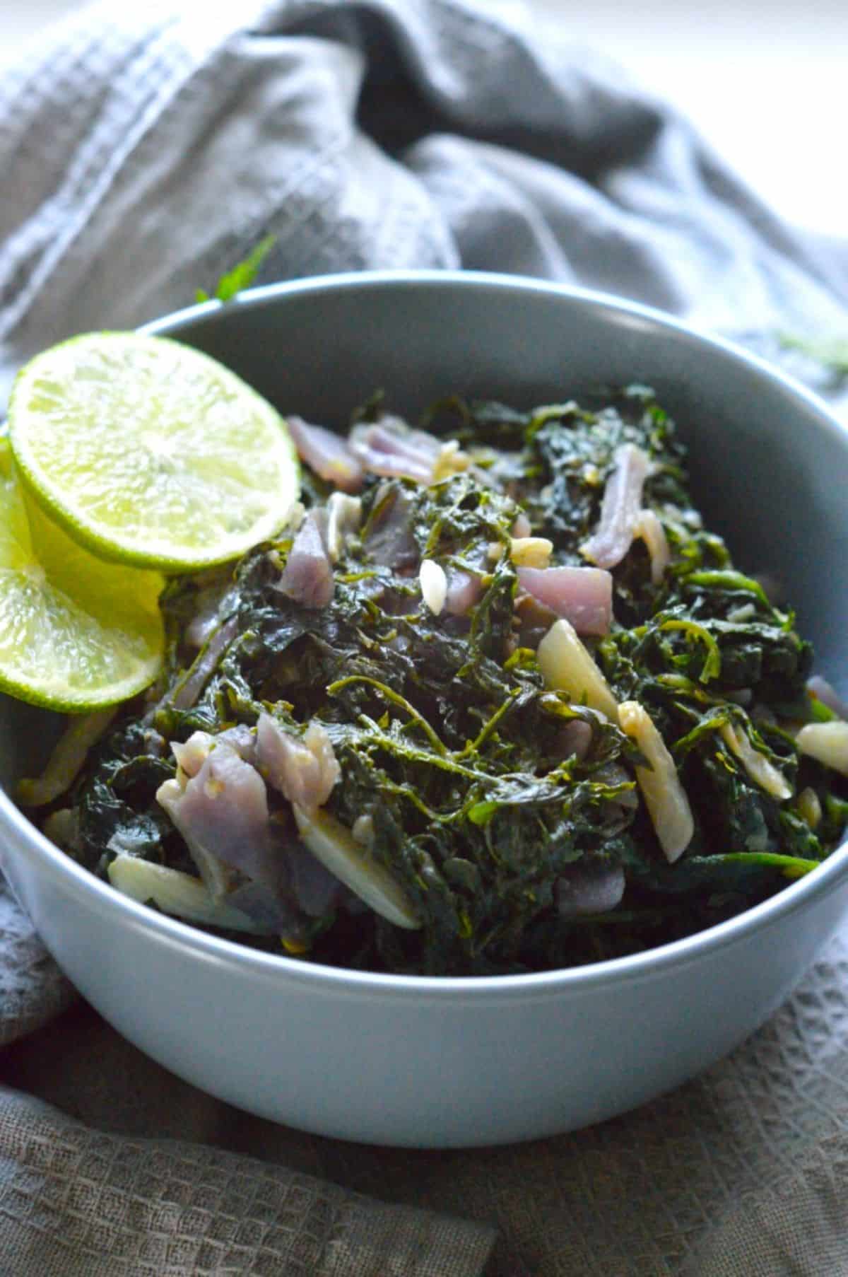 Carrot Greens Sabzi in a blue bowl.