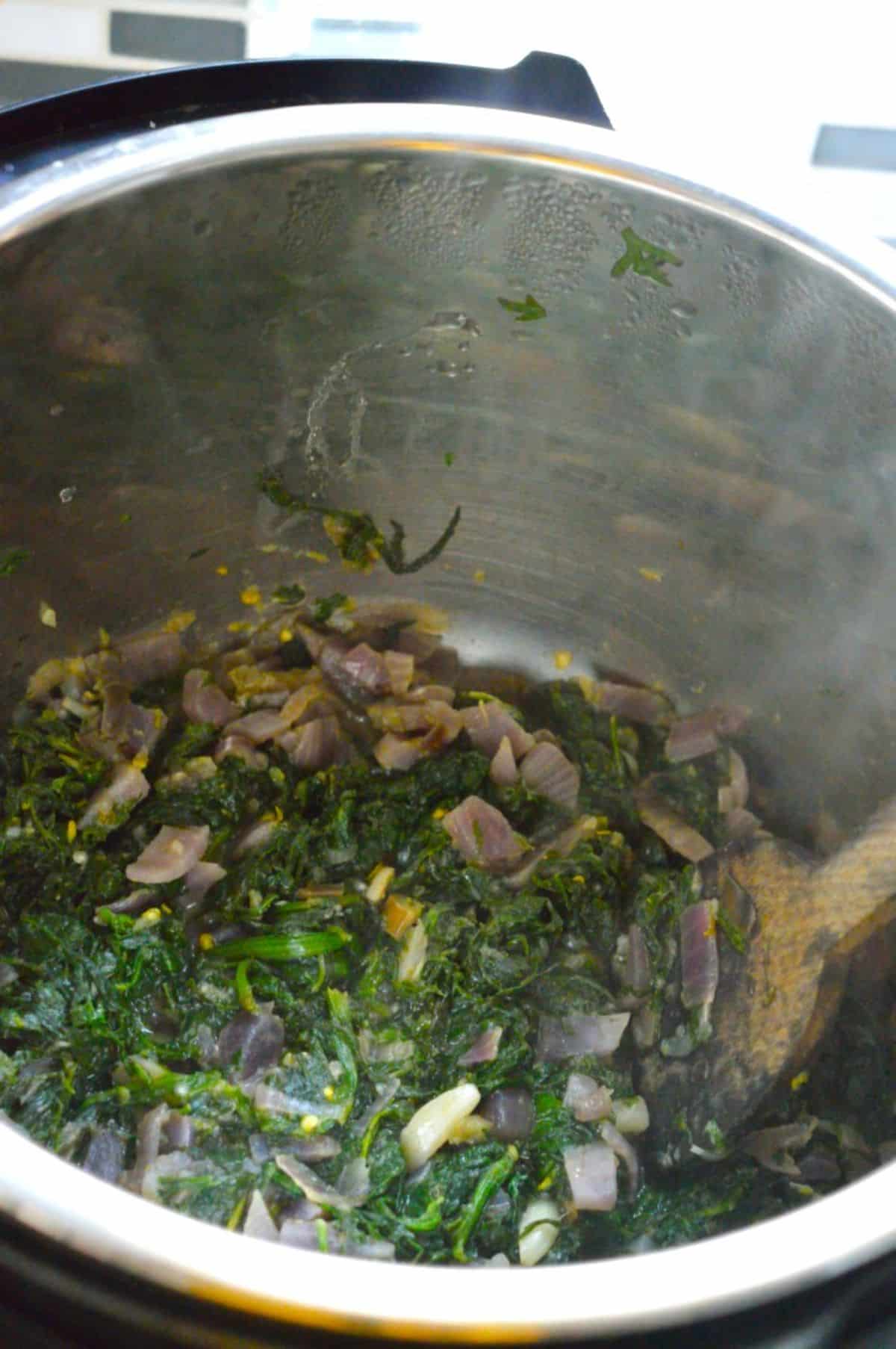 Carrot Greens Sabzi chopped veggies in a pot.
