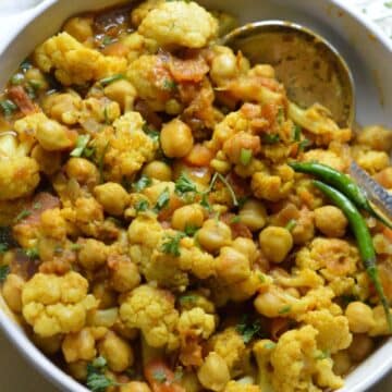 Chana Gobi Masala dish in a white bowl.