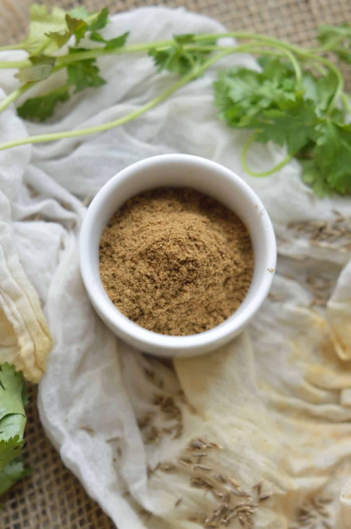 Cumin Powder in a white bowl.