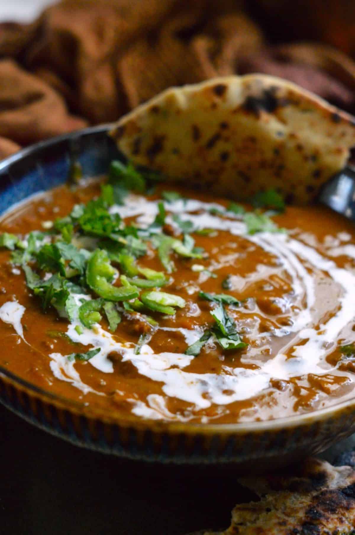 Dal Makhni dish in a blue bowl.