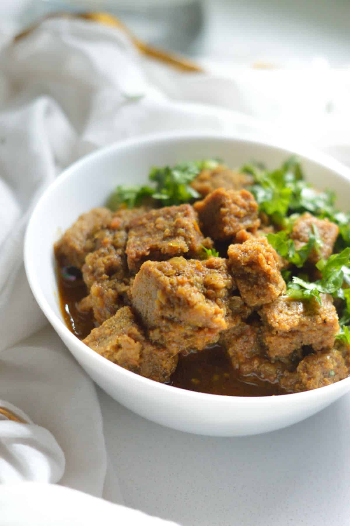 Dhoka Dalna dish in a white bowl.