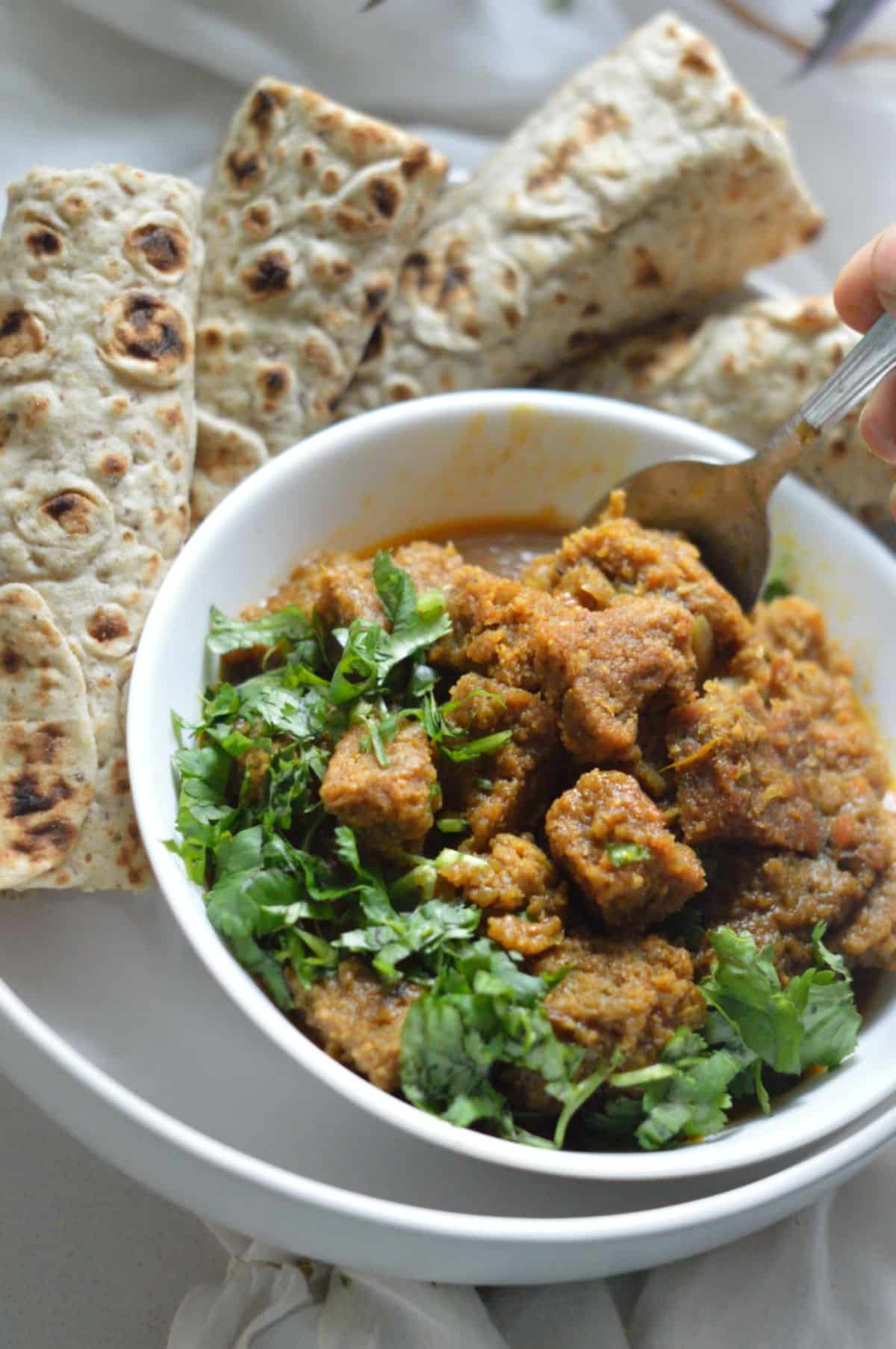 Dhoka Dalna dish in a white bowl.