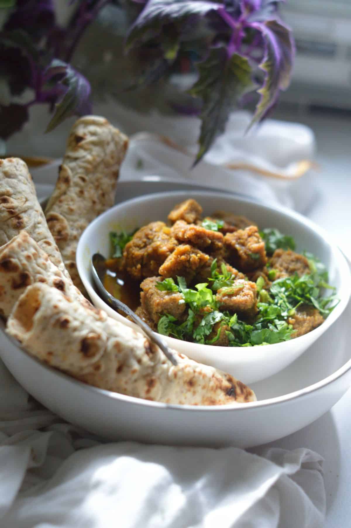 Dhoka Dalna dish in a white bowl.