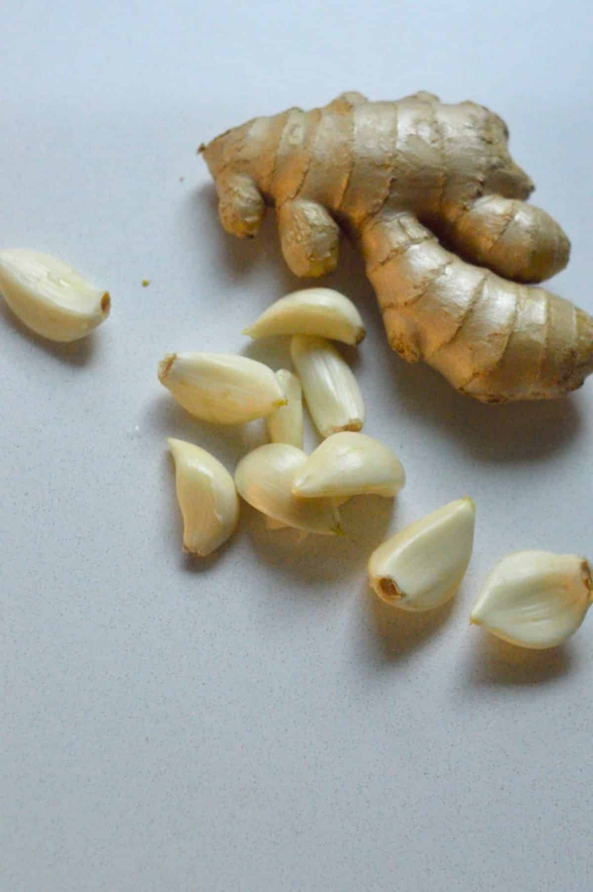Ginger root and peeled garlic cloves.