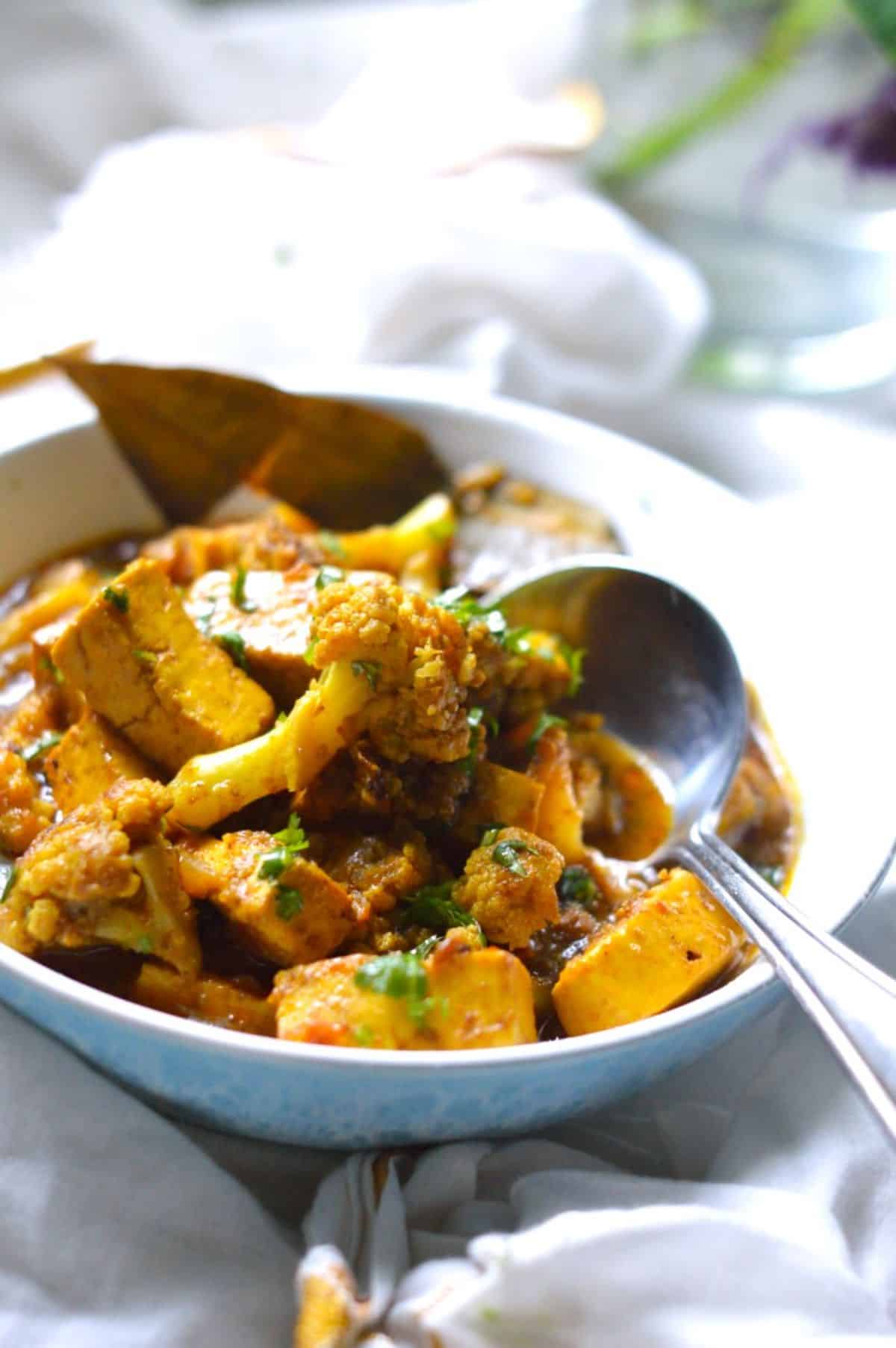 Gobi Paneer dish in a blue-white bowl.