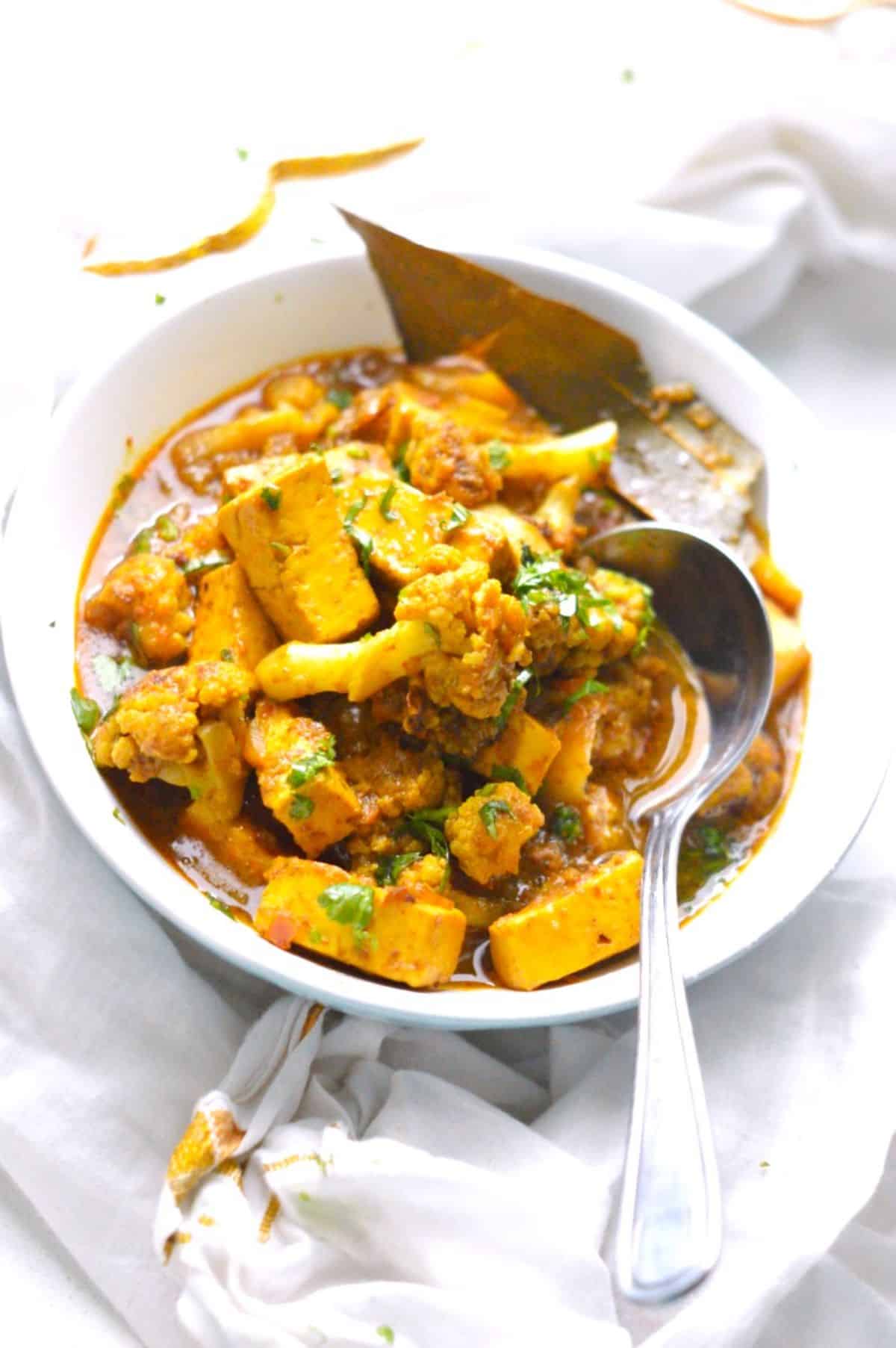 Gobi Paneer dish in a blue-white bowl.