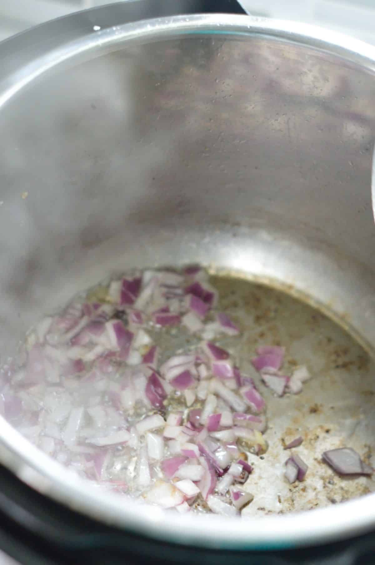 Chopped onions in a pot.