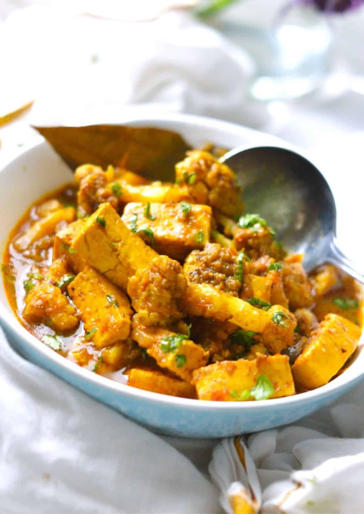 Gobi Paneer dish in a blue-white bowl.