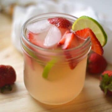 Homemade Water Kefir with fruits in a glass cup.