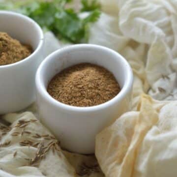 Cumin Powder in two white bowls.