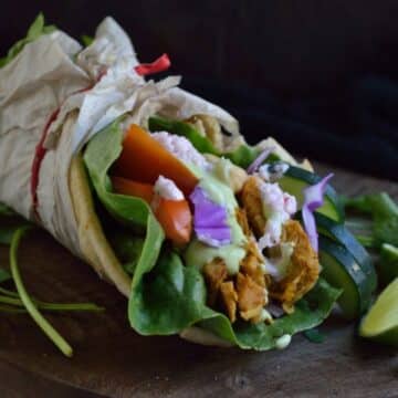 Jackfruit Curry Gyro on a wooden tray.