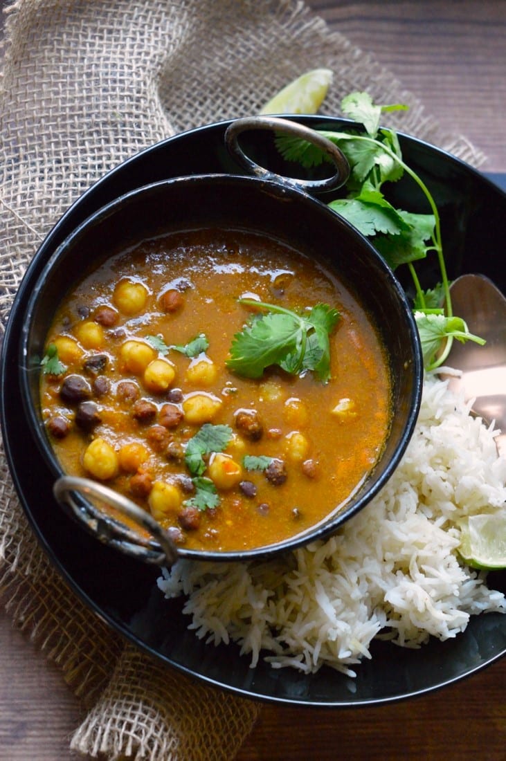 Mixed Chickpeas Curry in a black bowl.