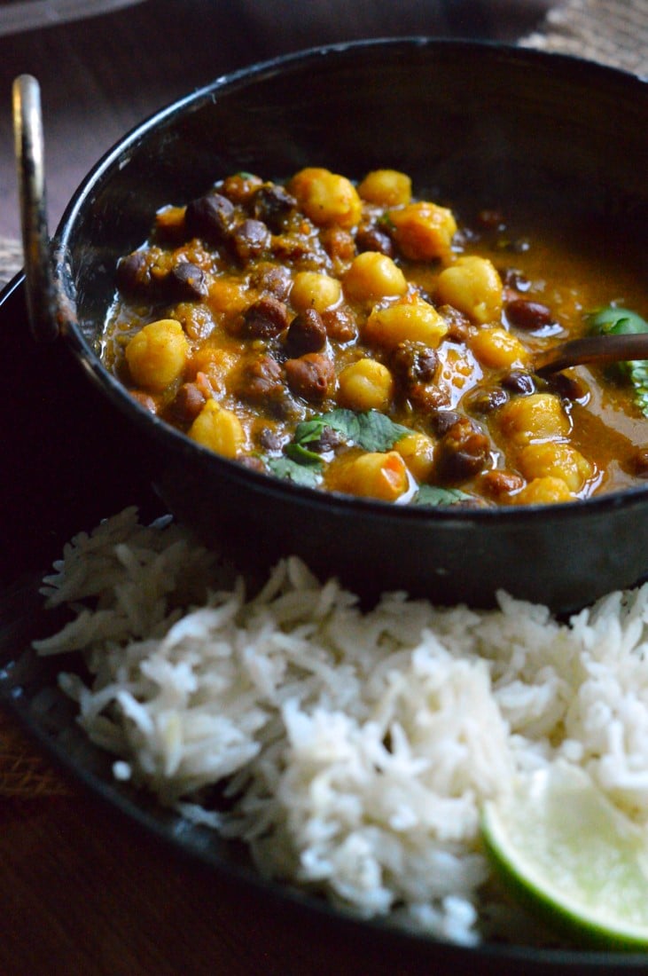 Mixed Chickpeas Curry in a black bowl.