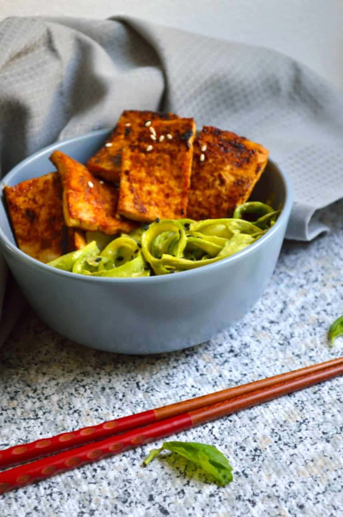 Pan-Fried Sesame Garlic Tofu in a blue bowl.