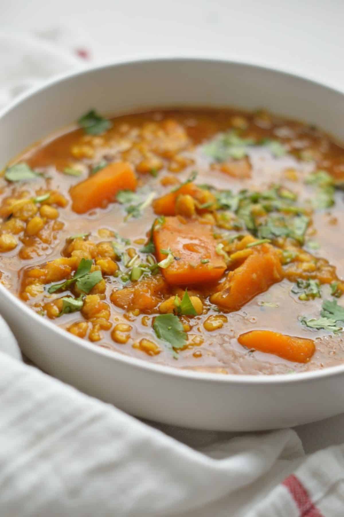 Pumpkin Chana Dal in a white bowl.