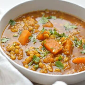 Pumpkin Chana Dal in a white bowl.