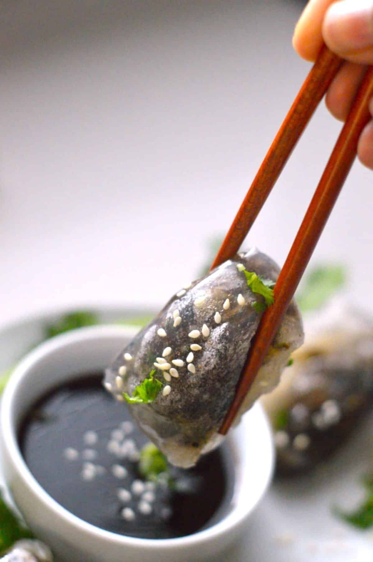 Rice Paper Dumpling held with chopsticks.