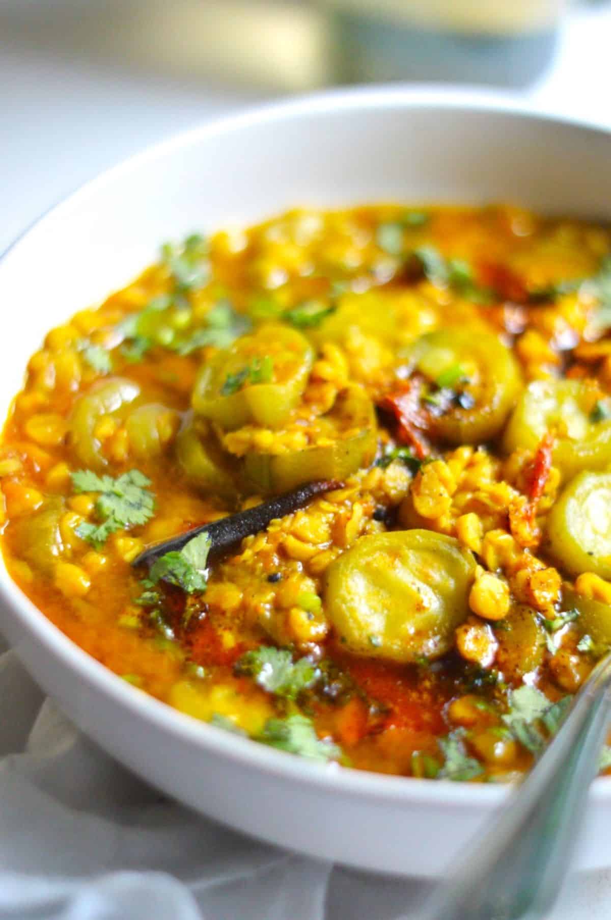 Ridge Gourd Chana Dal in a white bowl.