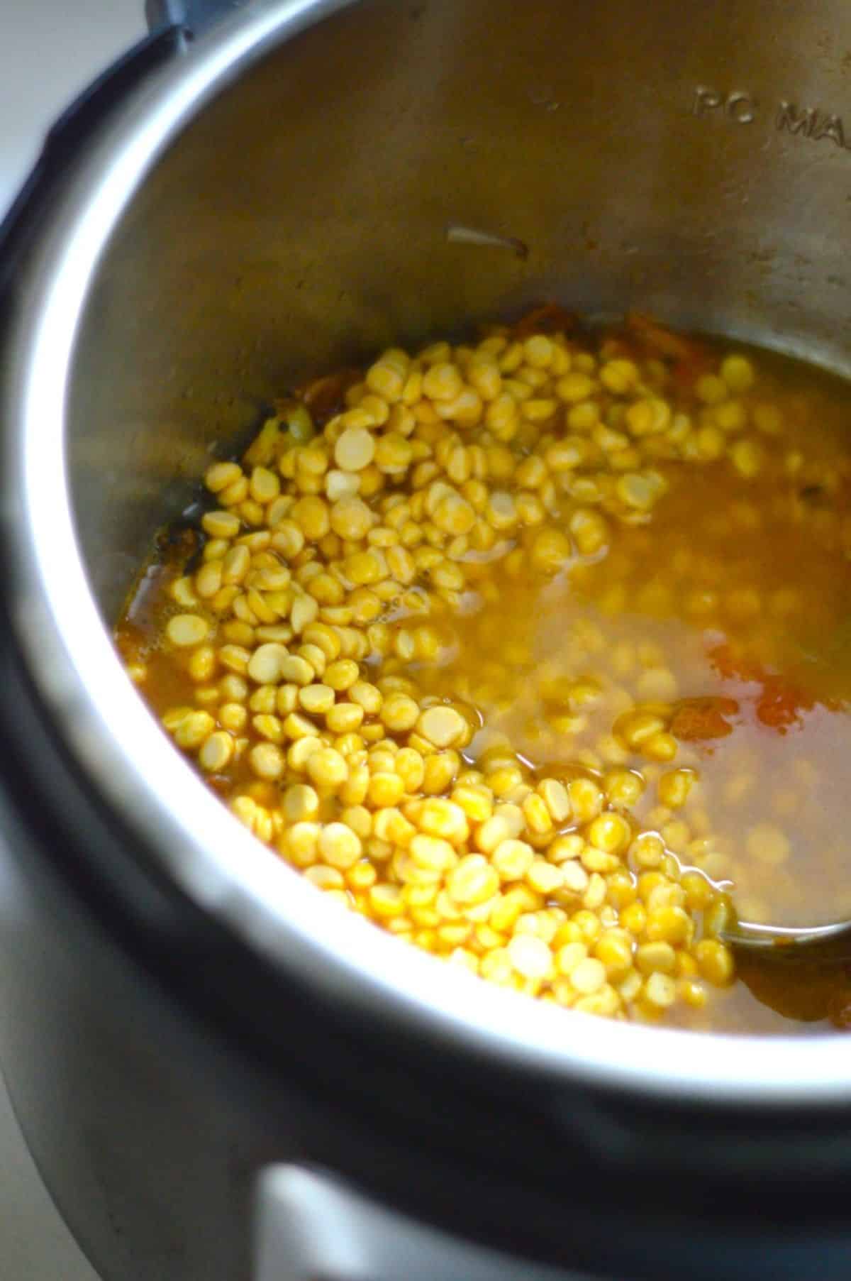 Ridge Gourd Chana Dal ingredients in a pot.