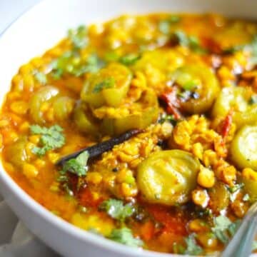 Ridge Gourd Chana Dal in a white bowl.