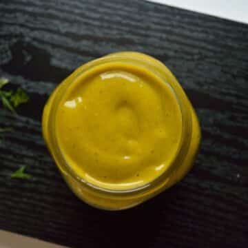 Spicy mango dressing in a glass jar.