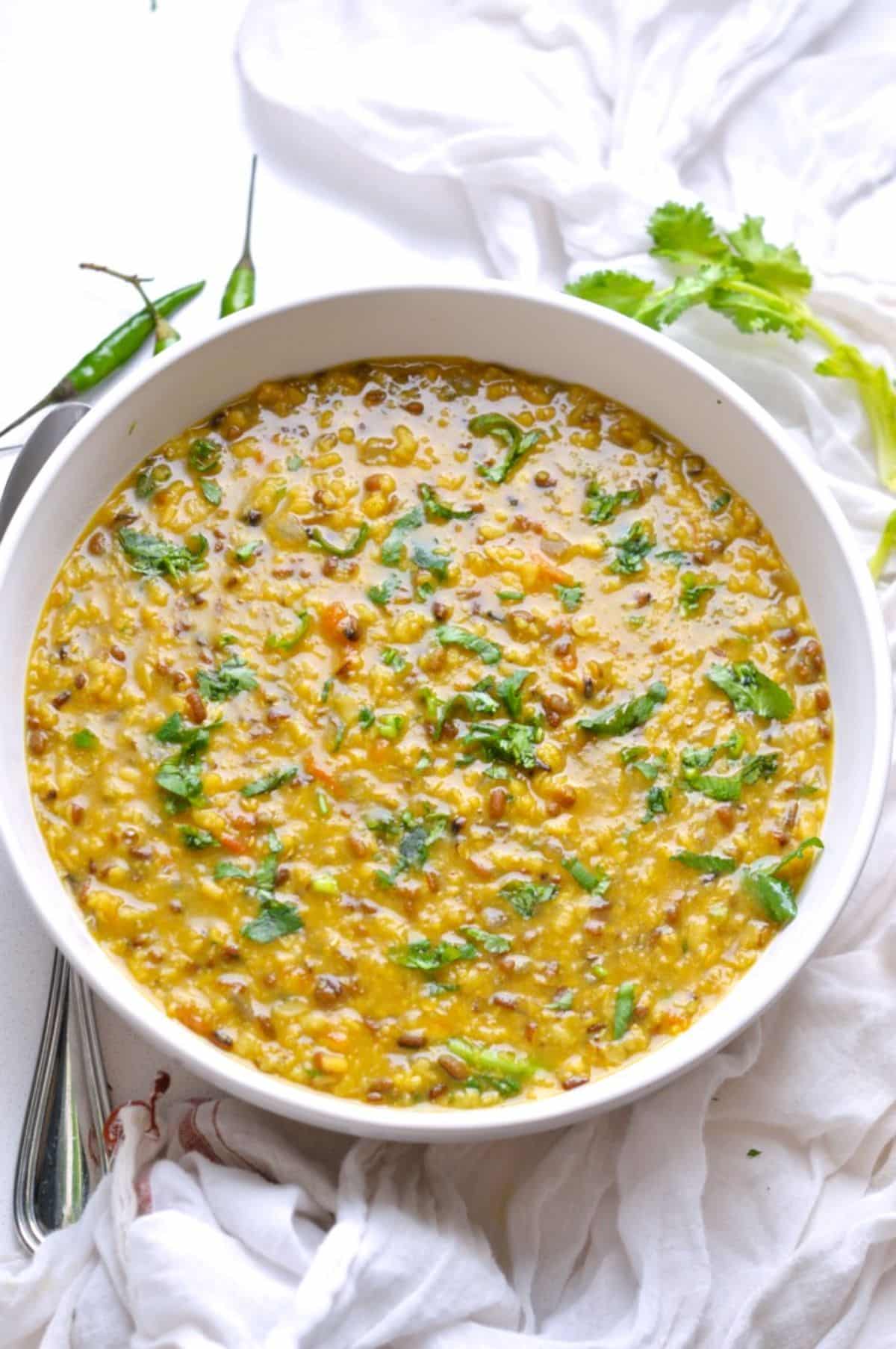 Spicy Indian Urad Dal in a white bowl.