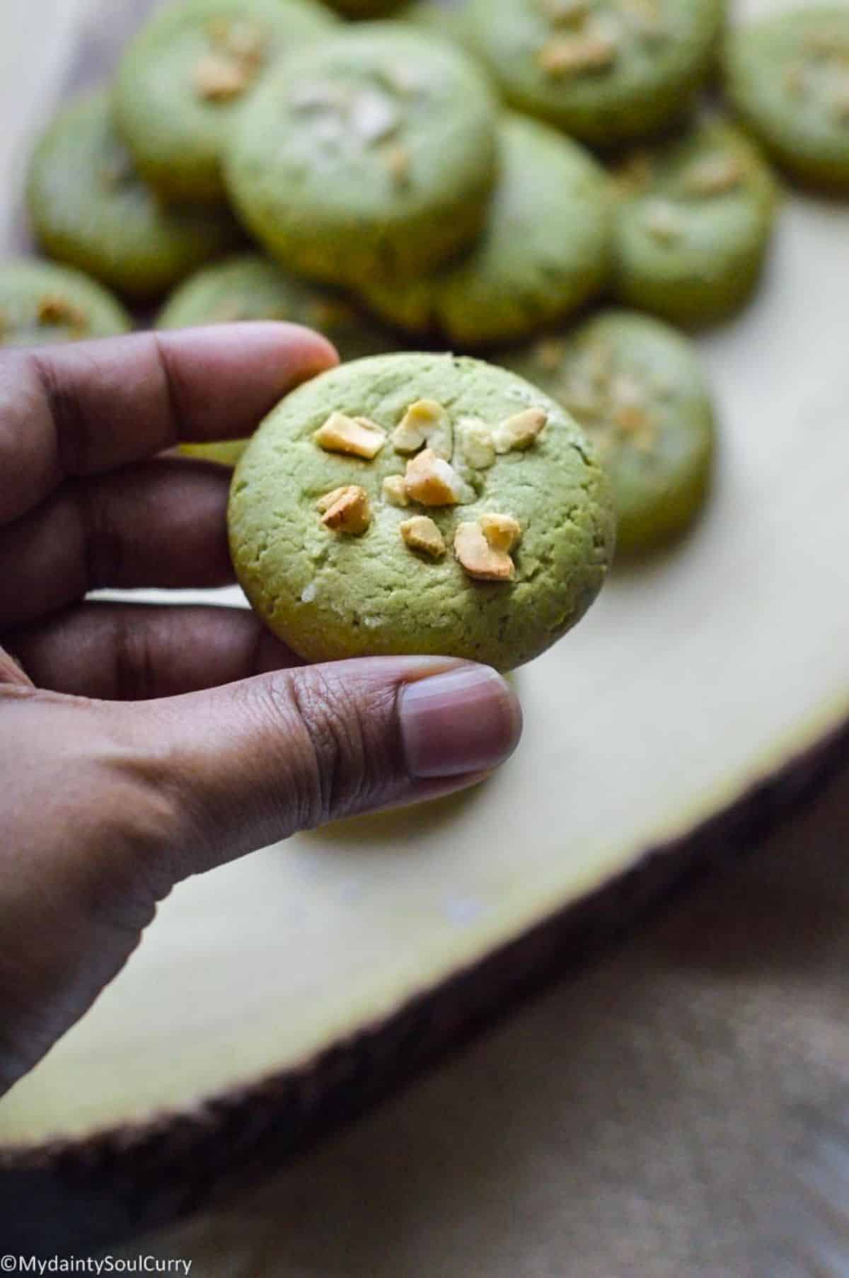 Vegan Matcha Cookie held by hand.