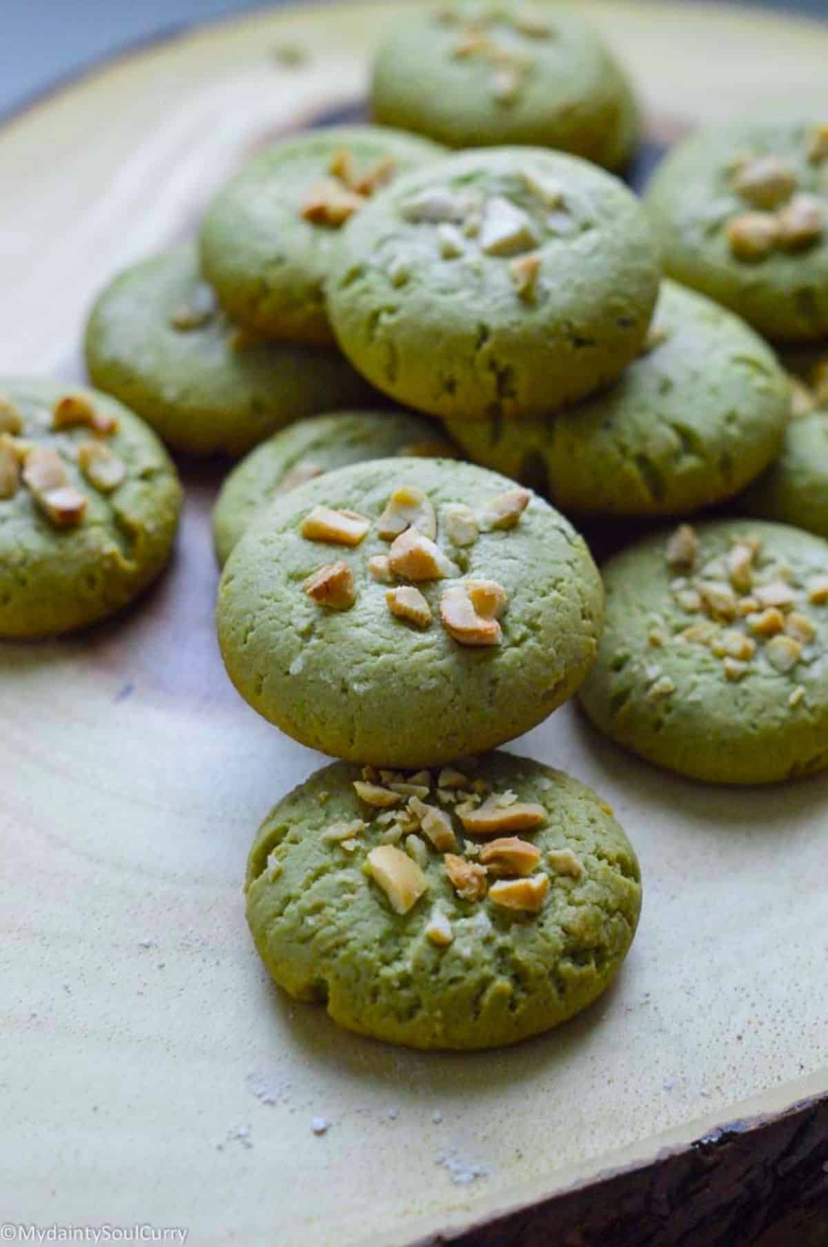 Vegan Matcha Cookies on a wooden tray.