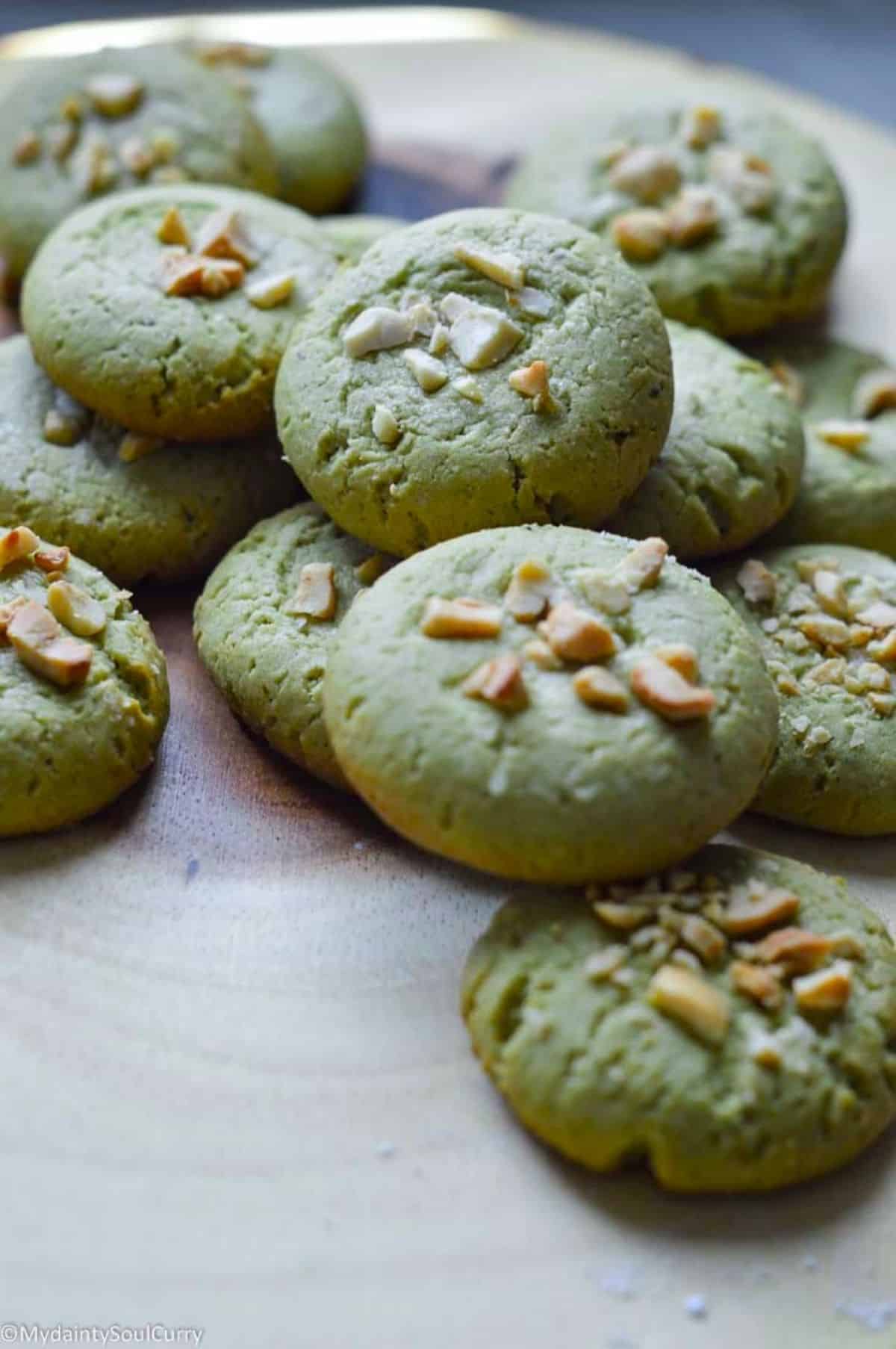 Vegan Matcha Cookies on a wooden tray.