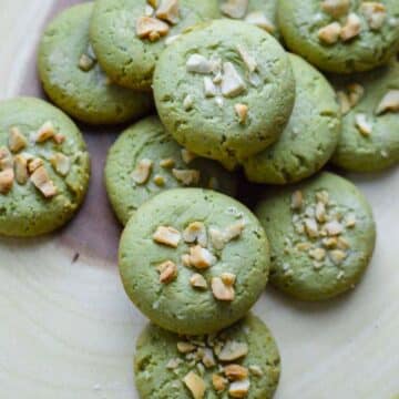 Vegan Matcha Cookies on a wooden tray.