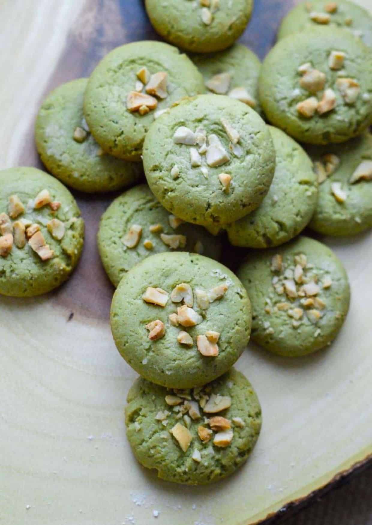 Vegan Matcha Cookies on a wooden tray.