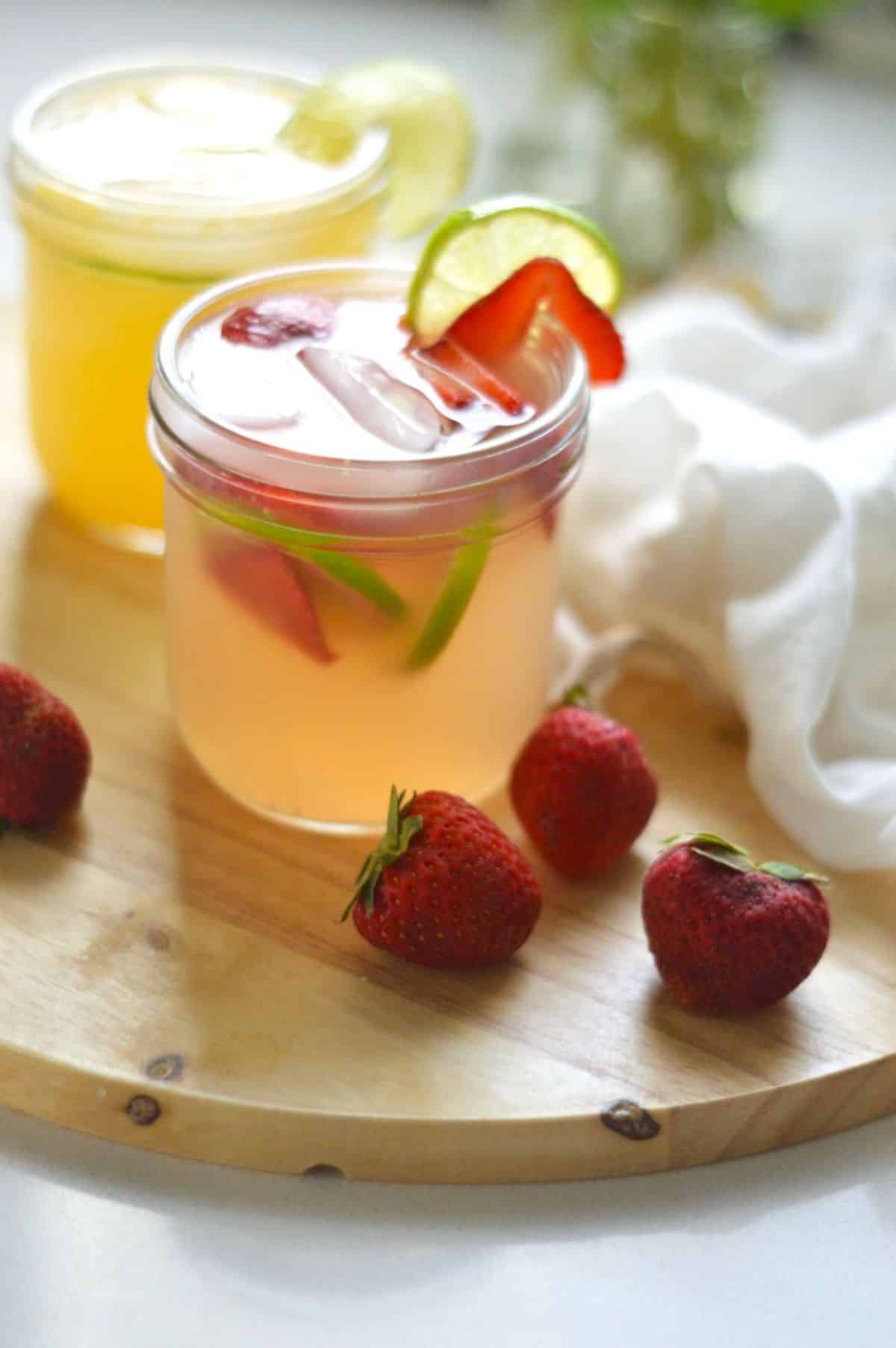 Homemade Water Kefir with fruits in a glass cup.