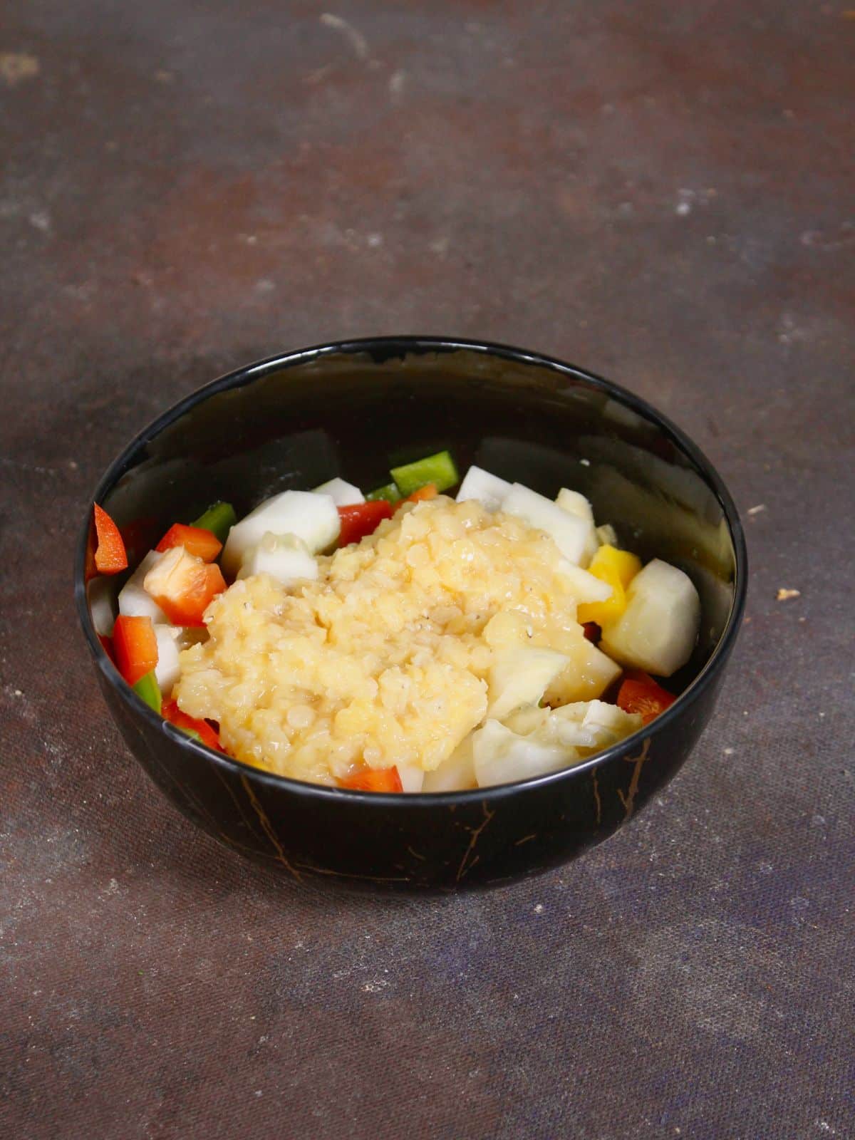 take chopped vegetables with boiled lentils in a bowl 