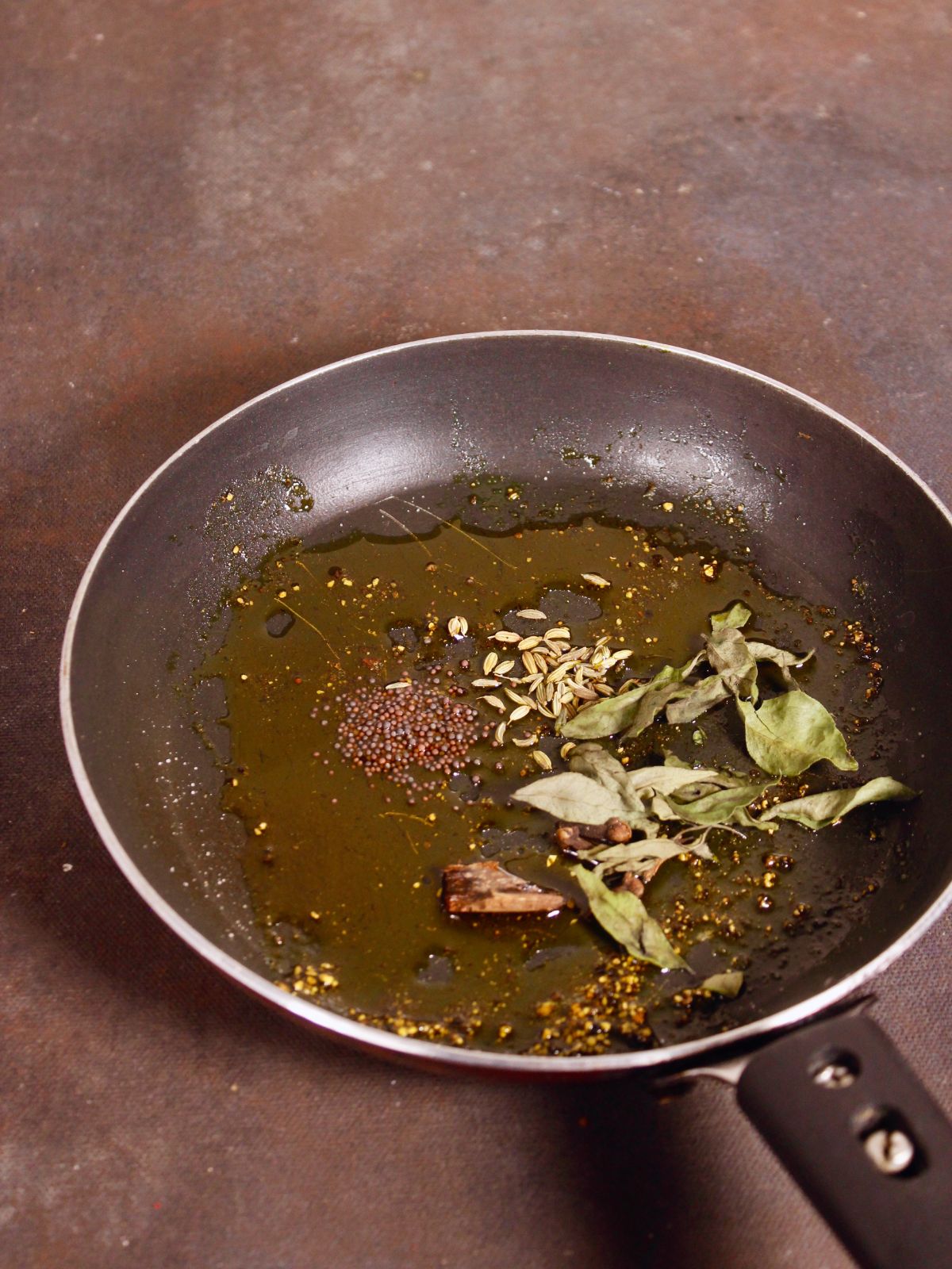 add curry leaves and spices to the pan 