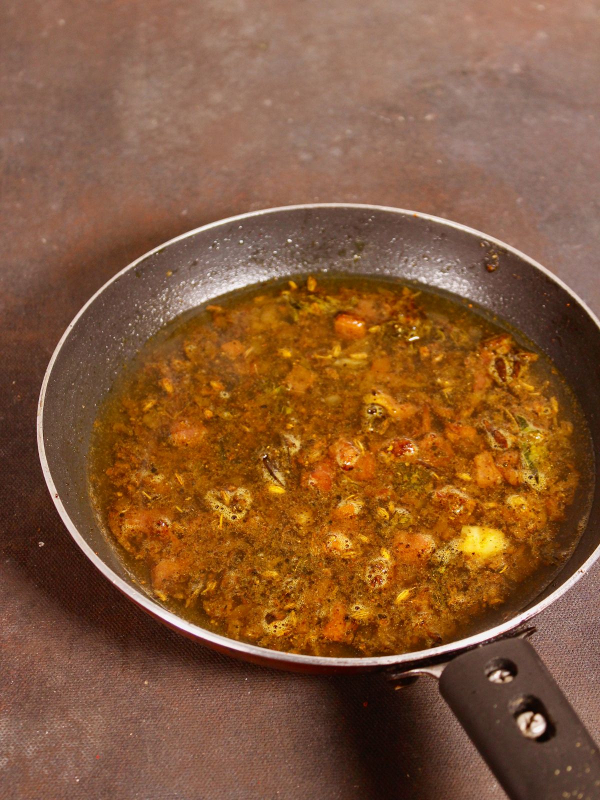 add water to the pan and cook well 