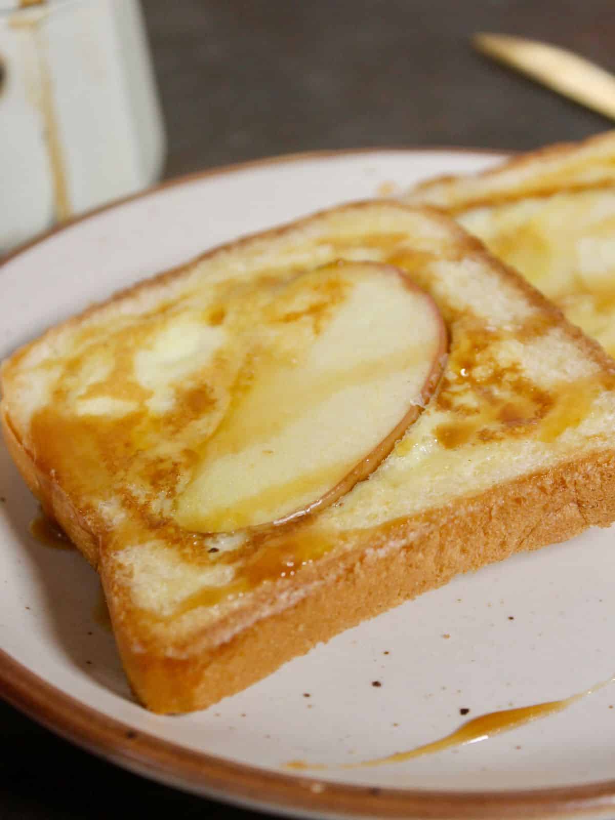side view image of French toast with apple twist