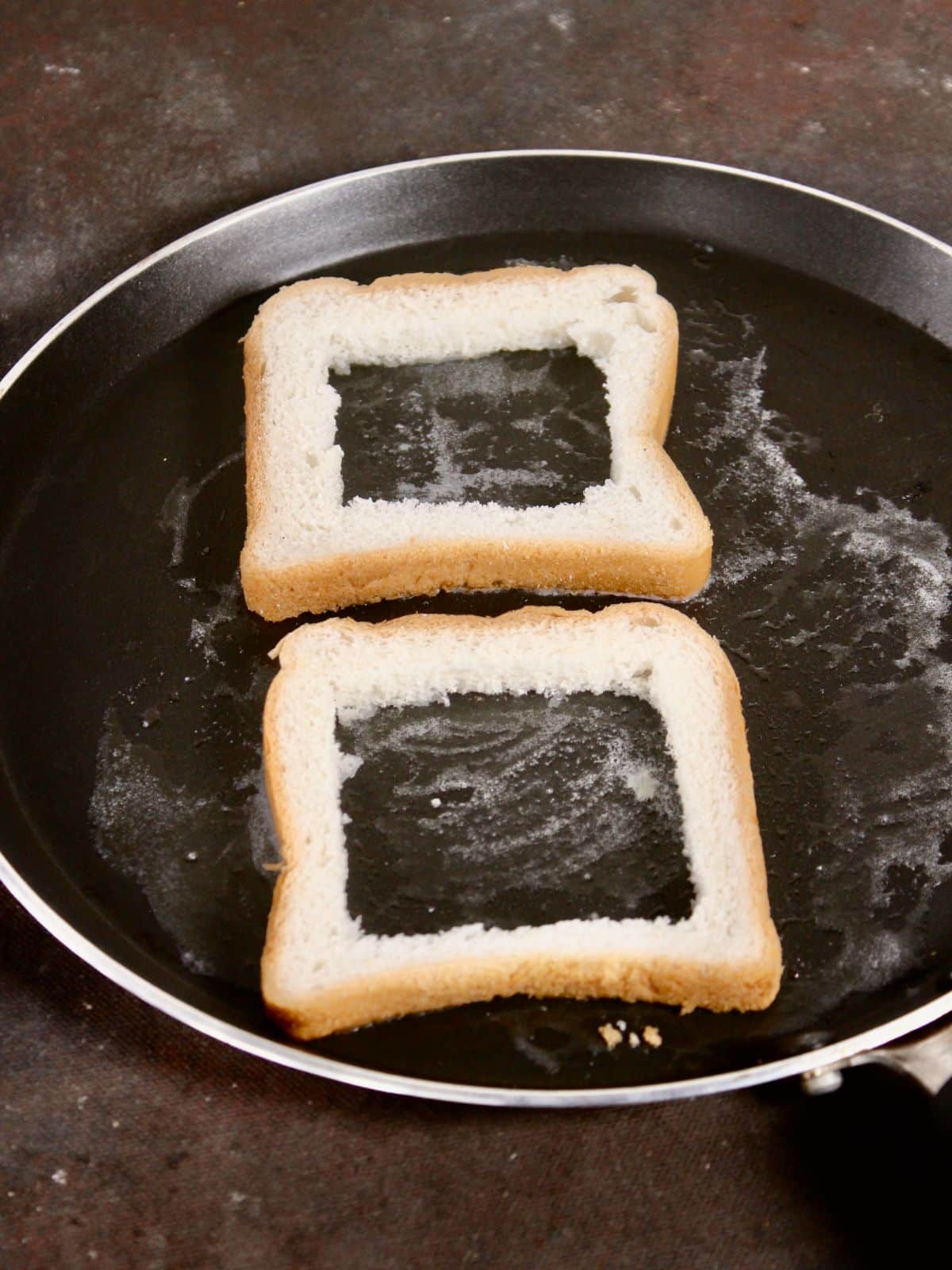 cut the slices from the middle and put it on the pan to toast 