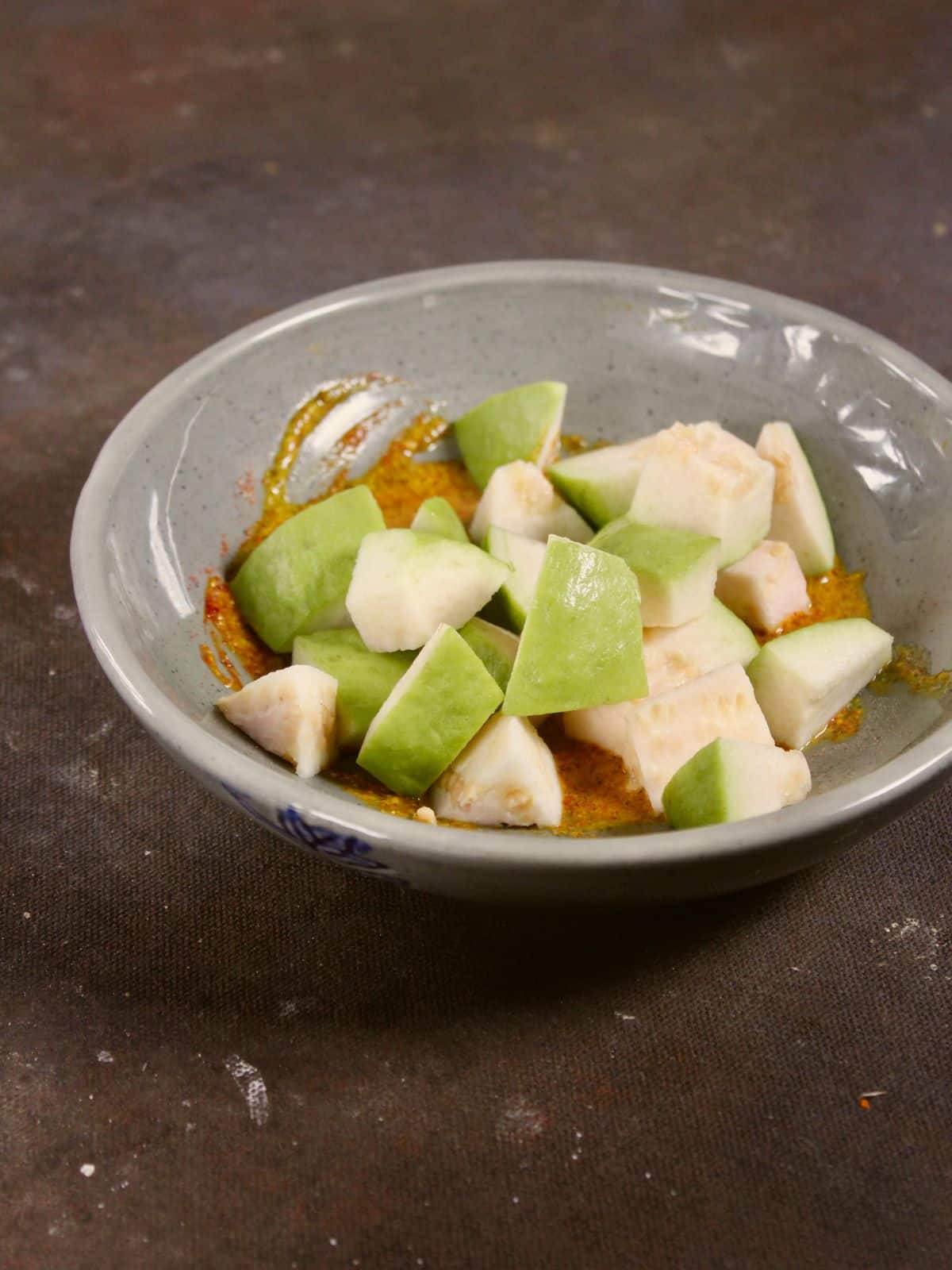 add chopped guava pieces to the spice mixture 