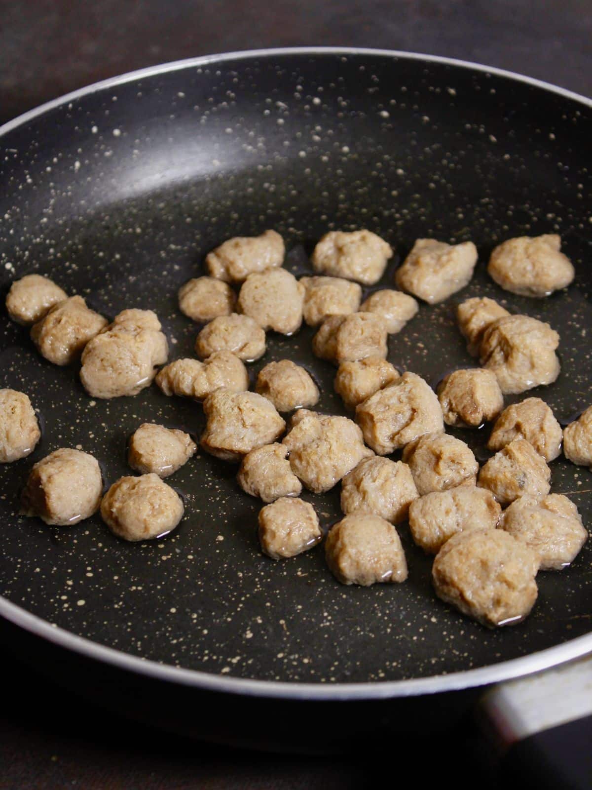 soak soya chunks in hot water in a pan 