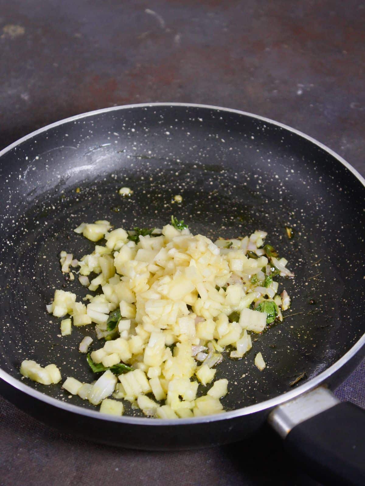 add chopped pineapples to the pan and mix well