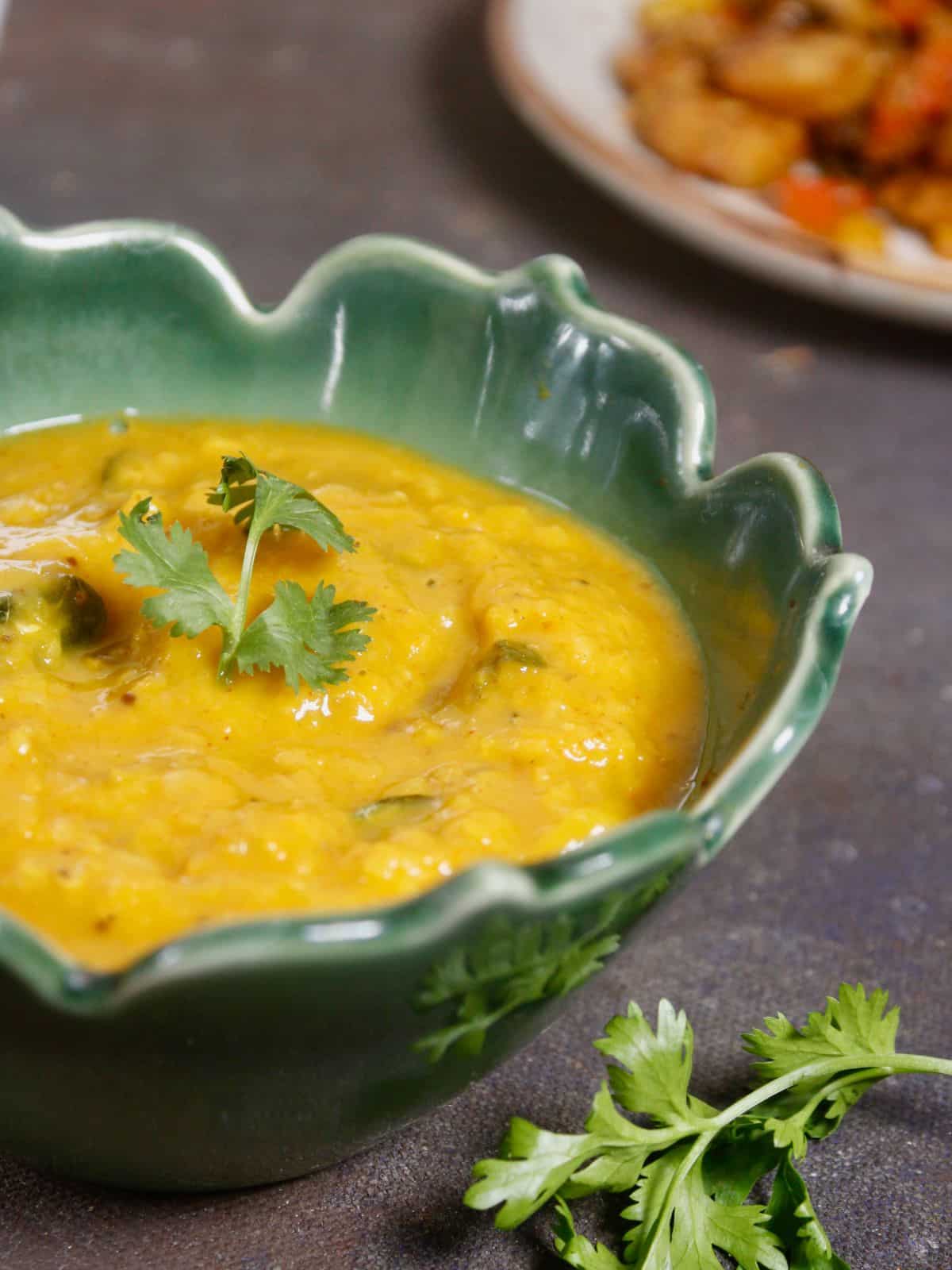 half bowl of sweet and sour pineapple dal