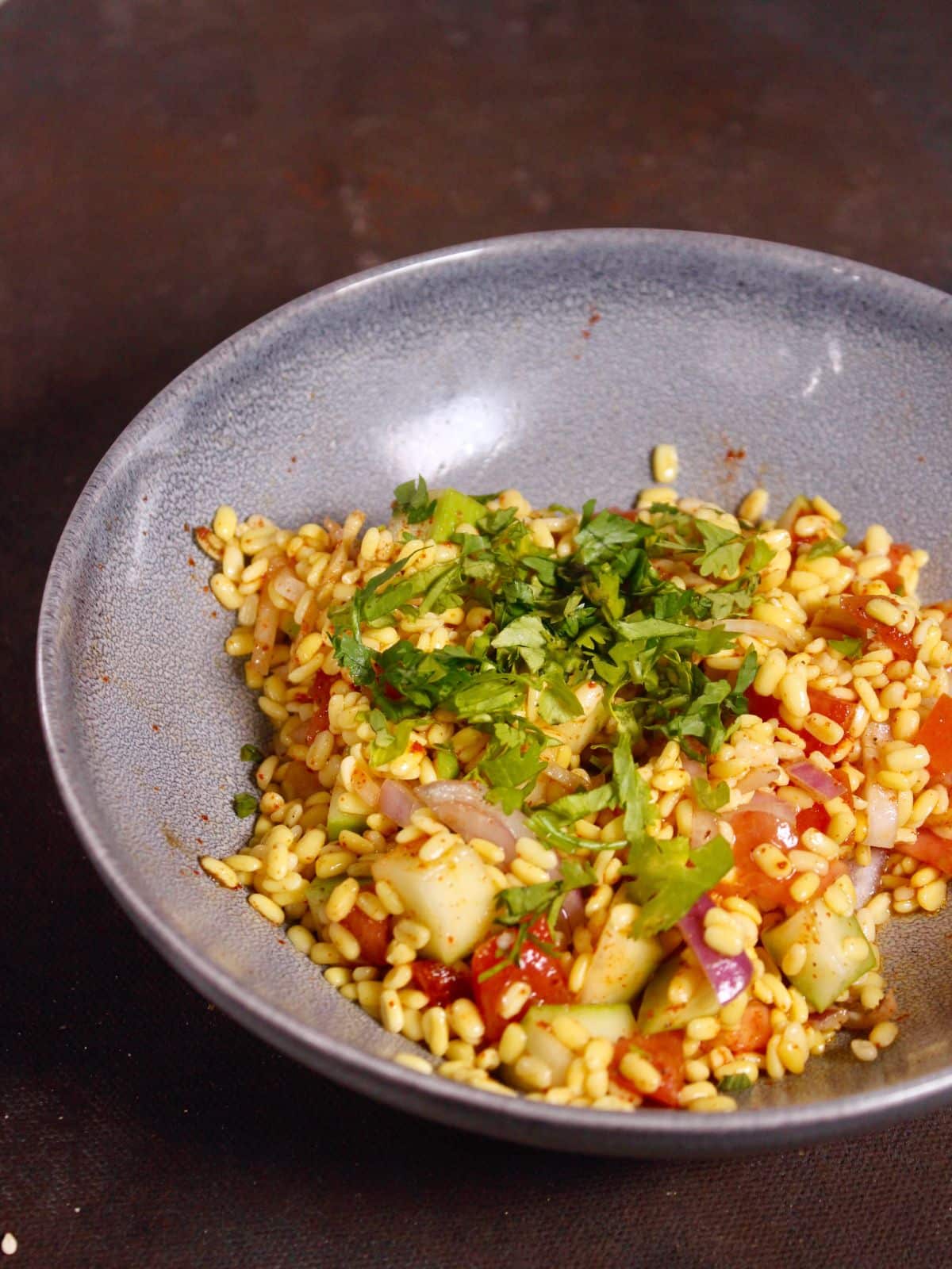 add chopped coriander leaves to the bowl and mix well