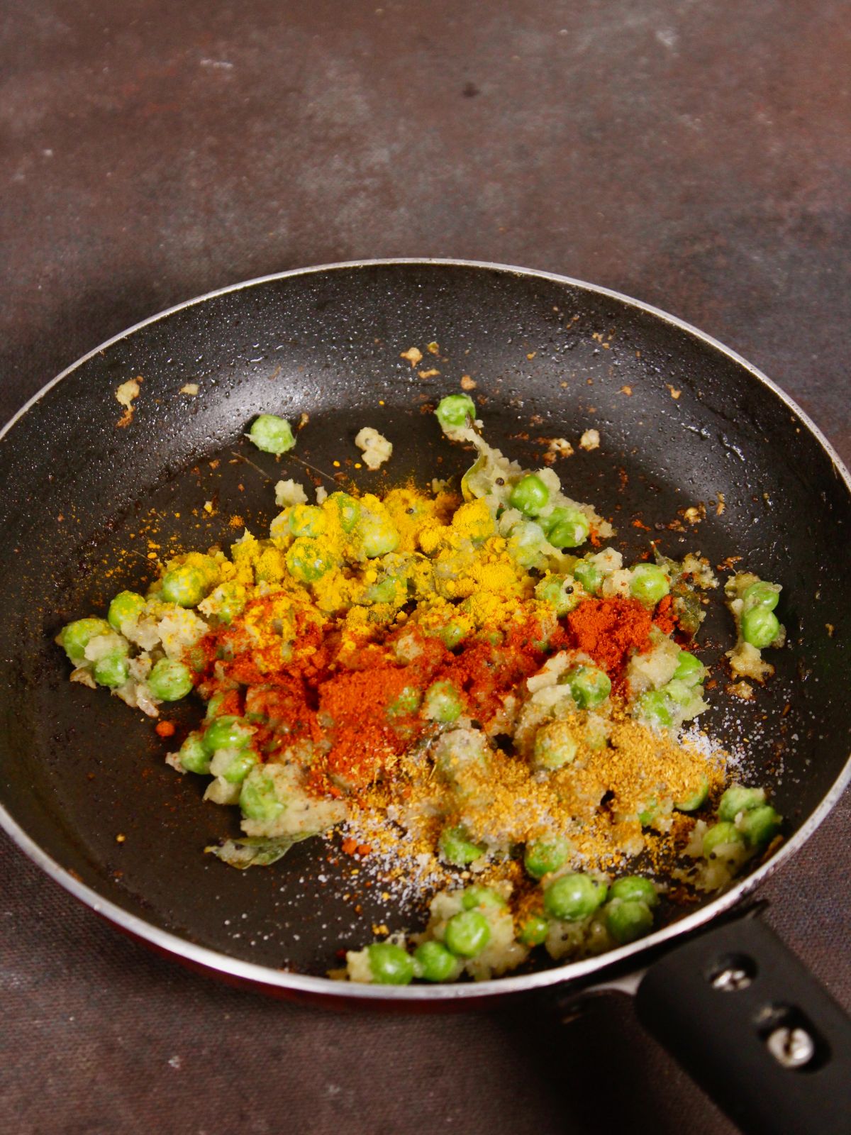 add powdered spices to the pan and mix well 